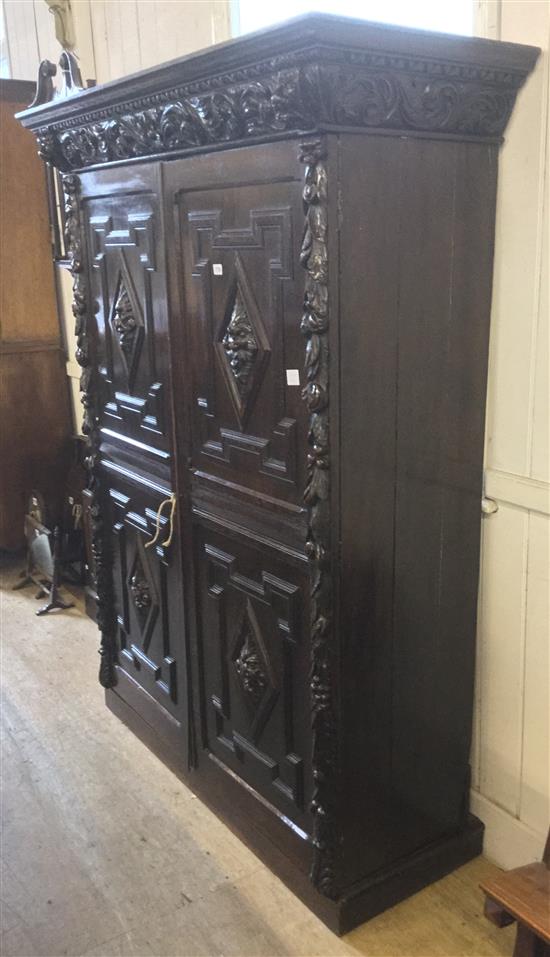 Carved oak two door cupboard